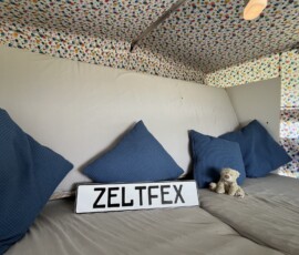 Schlafbereich mit Kinderbett als Sofa
